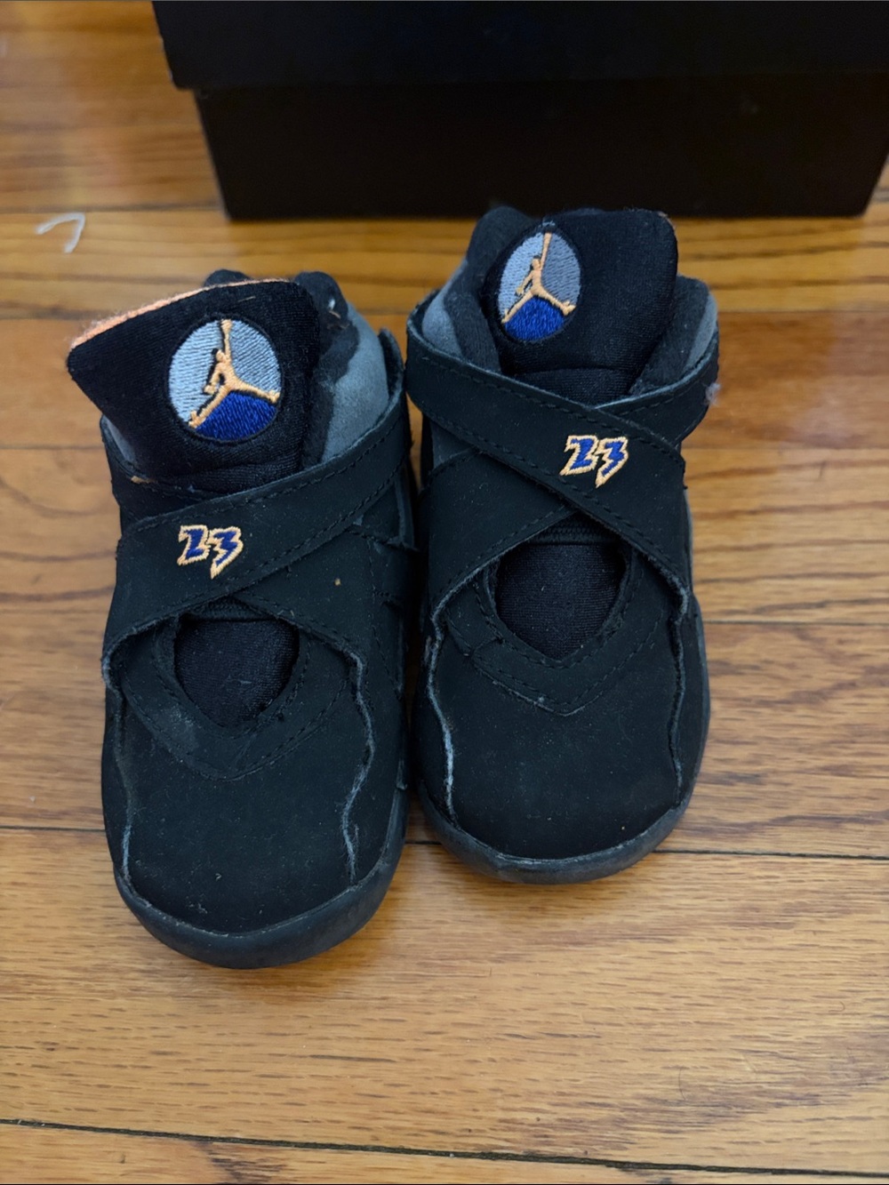 Jordan Kids Black High-Top Sneakers with Orange and Blue Accents